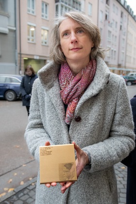 Dr. Eva Tyrell with the Memorial Sign for Heinrich Flaschner