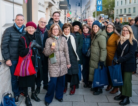 Group picture with the Memorial Sign for Anna Caspari