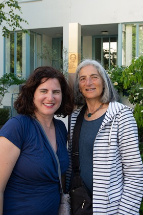 JoAnn Hershten (left) with the Memorial Signs