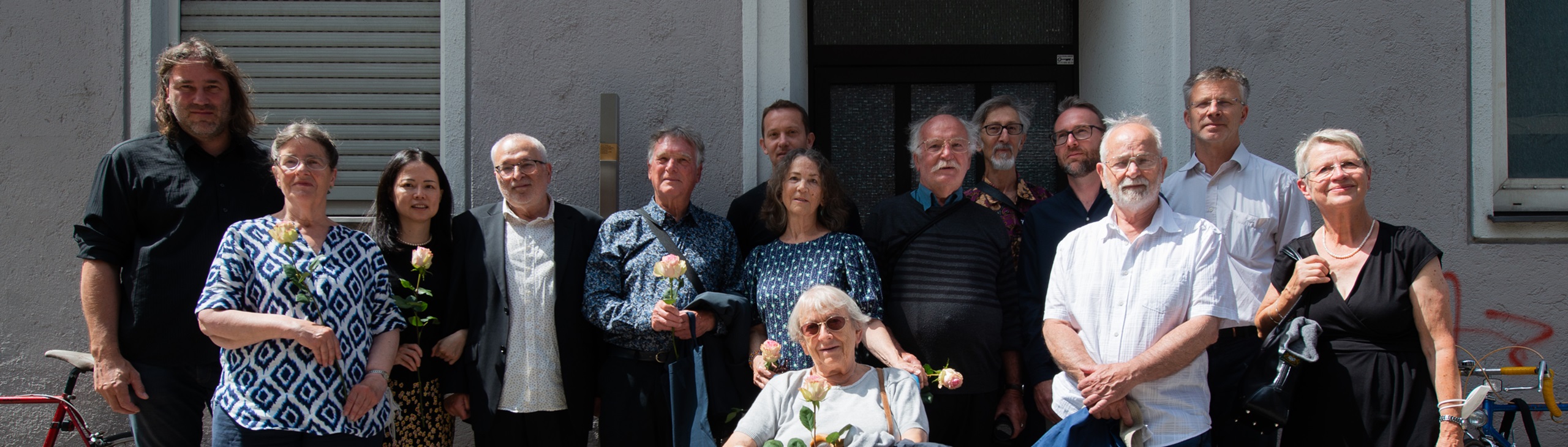 Group picture in front of the Memorial Sign for Richard Burger