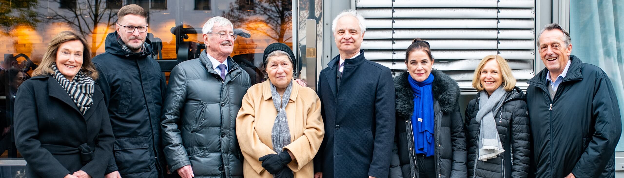 Group picure with the Memorial Sign for Fritz Zieglwallner