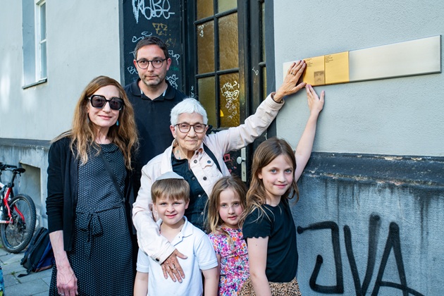 Relatives with Memorial Signs for Necha and Abraham Schindler