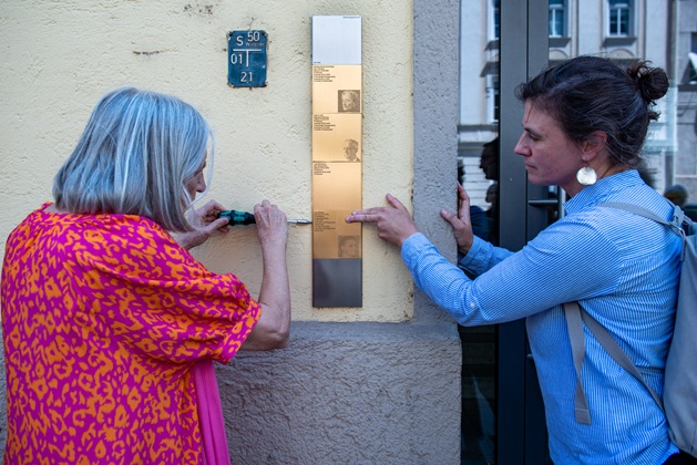 Relatives install the Memorial Sign for Anna Riedner an