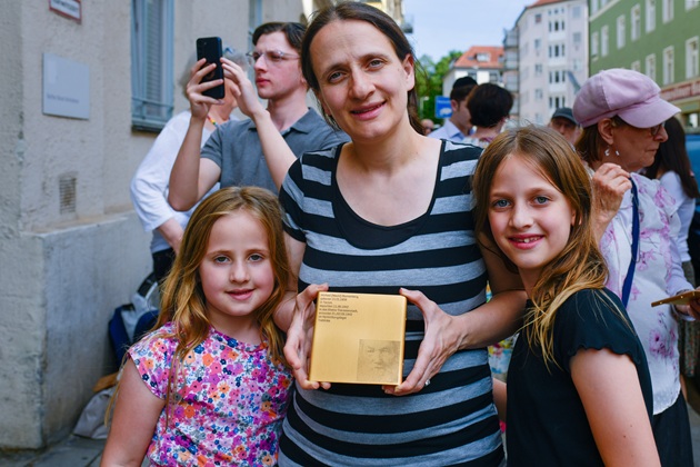 Relatives with the Memorial Sign for Michael Blumenberg