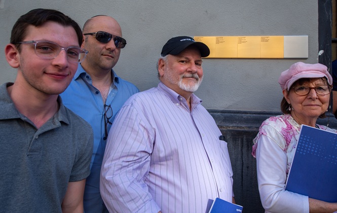 Relatives with Memorial Signs for the Steinberg family