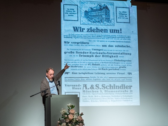 Prof. Dr. Stefan Wimmer displaying historical documents