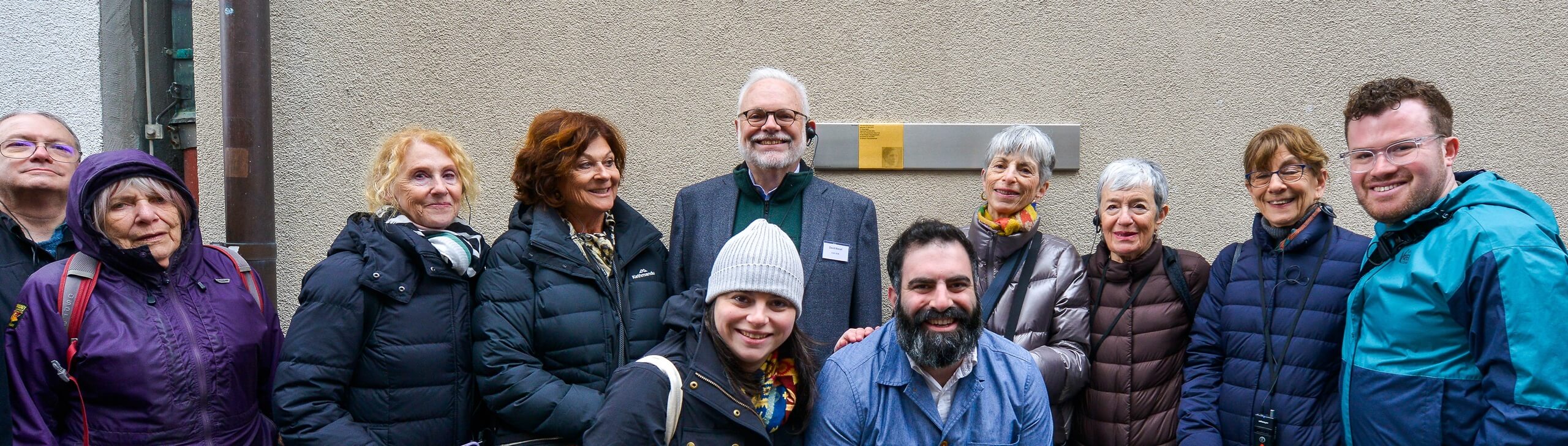 Group picture with the Memorial Sign for Hermine Bernheimer