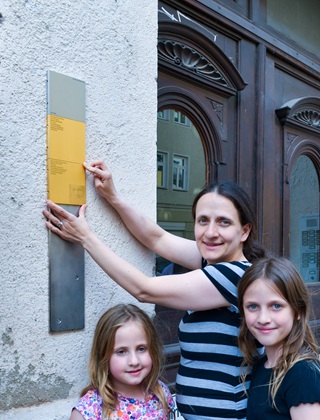 Relatives with the Memorial Signs for Mina and Michael Blumenberg
