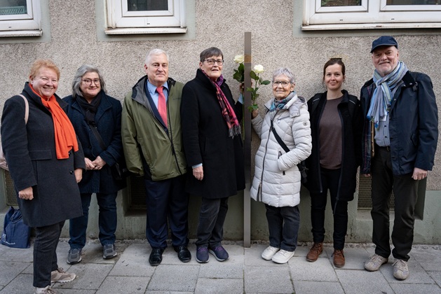 Group picture with the Memorial Sign for Franz Fellner