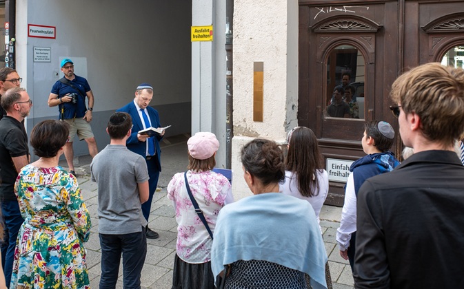 Rabbi recites the prayer 'El male Rachamim'