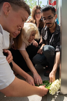 The family placing flowers