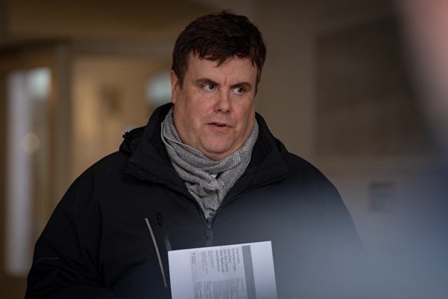 Patric Wolf speaks on behalf of the district committee