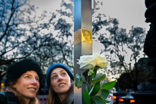 Relatives next to the Memorial Sign for Anna Caspari