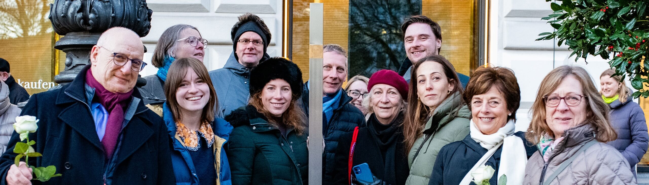 Group picture with the Memorial Sign for Anna Caspari