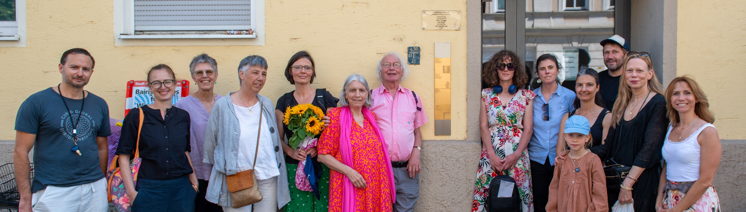 Group picture with the Memorial Sign for Anna Riedner