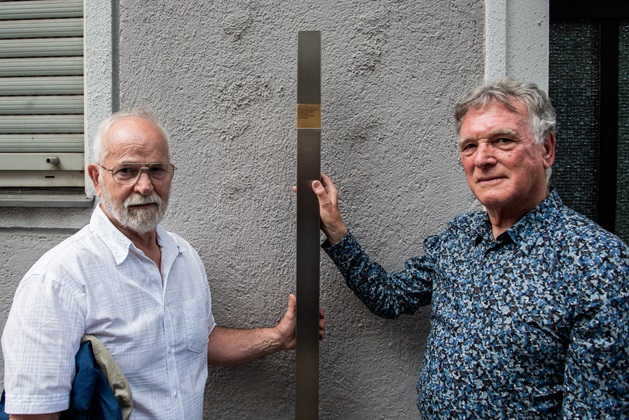 Philip Klein with the Memorial Sign for his great-grandfather Richard Burger